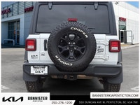 The 2022 Jeep Wrangler Unlimited Willys 4x4 in a classic white exterior and rugged 44 drivetrain is... (image 2)