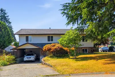 This lovely home on a large corner lot in a quiet cul-de-sac in North Delta.The upper level features...
