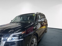 Experience luxury and power in the 2024 Nissan Armada 4x4 Platinum, presented in an eye-catching Bla... (image 5)