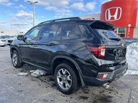 Conquer every adventure with the rugged yet refined 2023 Honda Passport TrailSport, a vehicle engine... (image 6)