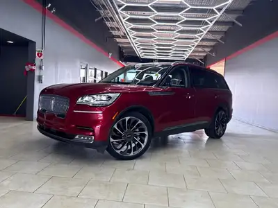 Experience the sophisticated elegance of the 2020 Lincoln Aviator Reserve in a stunning red exterior...