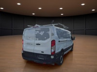 The 2023 Ford Transit Cargo Van, clad in a clean white finish and equipped with rear-wheel drive, of... (image 4)
