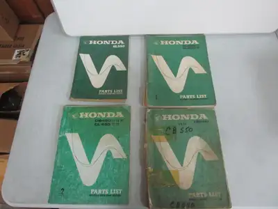 Old Honda factory parts books. First picture shows all 4 books. Next 3 pictures: 1969-1970 SL350 (SO...