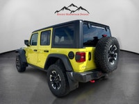 THIS VERY RARE VELOCITY YELLOW WRANGLER RUBICON WITH PLENTY OF OPTIONS INCLUDING 3.6L V6 PENTASTAR E... (image 2)