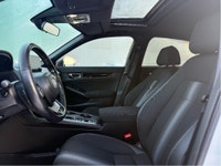 The 2025 Honda Civic Sedan Hybrid Sport in a stunning white finish combined with its FWD drivetrain... (image 8)