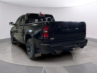 The 2026 Ram 1500 Big Horn, presented in a commanding Black finish and equipped with a robust 4x4 dr... (image 2)