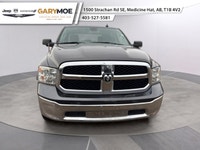 The 2022 Ram 1500 Classic SLT 4x4 Crew Cab stands out with its sophisticated gray exterior and power... (image 2)