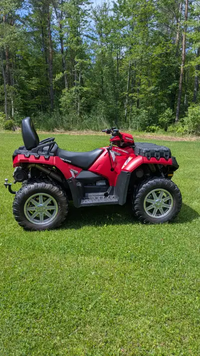 2013 Polaris Sportsman Touring 550 EPS ATV The Touring model offers comfortable seating for two ride...