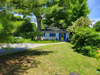 Welcome to a beautiful house, nestled in a forest of trees within the old town district of Niagara o...