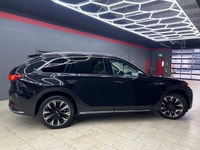 The 2024 Mazda CX-90 PHEV GT in a stunning black finish offers the perfect blend of luxurious style... (image 1)