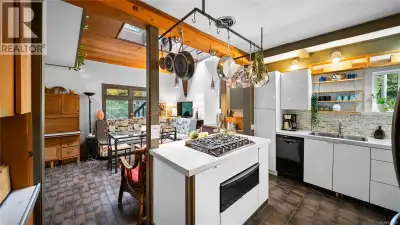 1168 Burnside is rare mixed-use offering with elevated views to Portage Inlet and Olympic Mountains....