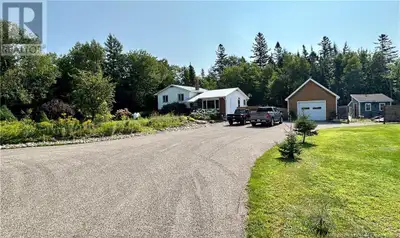 Nestled on a beautifully landscaped lot, this four level home offers three bedrooms, a new oversized...