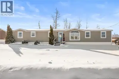 Welcome to 83 Tracadie Drive in Domaine Du Ruisseau! This beautifully renovated and modern mini home...