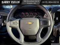 The 2026 Chevrolet Silverado 2500HD Work Truck in pristine white and equipped with a rugged 4x4 driv... (image 9)