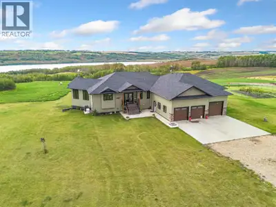 Built in 2018, this impressive fully finished executive acreage offers 2,888 sq. ft. of living space...