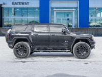 The 2024 GMC HUMMER EV SUV 2X commands attention with an electrified, wide-body stance that blends b... (image 2)