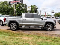 The 2023 GMC Sierra 1500 SLT Crew Cab Short Box 4-Wheel Drive in a refined gray finish offers except... (image 2)