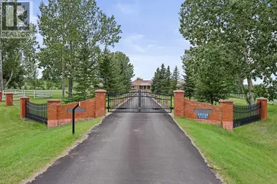 LOCATION, LUXURY & LAND! This beautifully landscaped 3.56-acre property sits just south of Heritage...