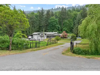 Over 15 private acres with 2 road frontages, perfect for peaceful country living! Beautiful rancher...