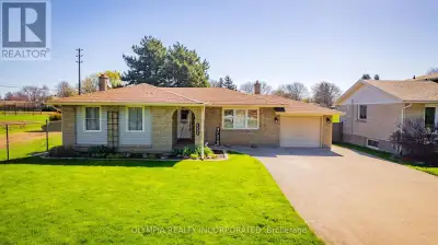 Move-in ready, North End Brick Bungalow nestled on 70 ft by 155 ft wide lot backing onto Meadowvale...