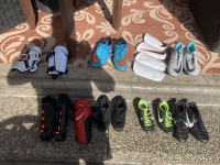  Various youth and adult Nike soccer cleats and chin guards