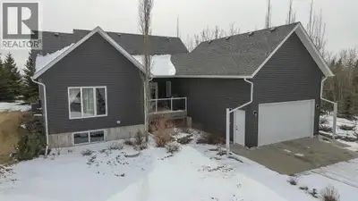 Looking for A Secluded Acreage, Minutes from Red Deer, with all the extras? This Absolutely Immacula...