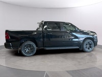The 2026 Ram 1500 Express 4x4 Crew Cab 57 Box is a powerful yet stylish black truck thats ready for... (image 5)