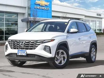 The 2023 Hyundai Tucson Preferred, featuring a brilliant Crystal White exterior complemented by a re...