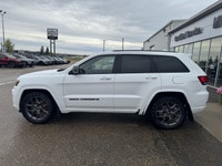 Our exclusive 2021 Jeep Grand Cherokee Limited 4X4 wraps assertive capability in a dramatic Bright W... (image 1)