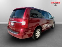 A spacious family minivan with comfortable seating, convenient features, and versatile cargo space,... (image 3)