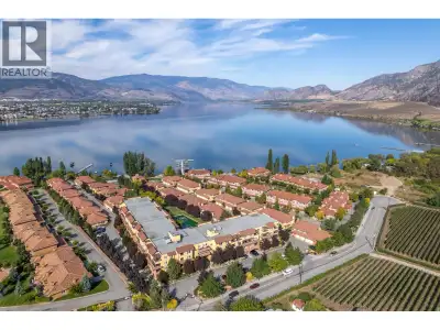 Immerse yourself in lakeside luxury with this exquisite top-floor gem featuring breathtaking vineyar...