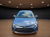 The 2021 Toyota Corolla LE in sleek gray with its reliable front-wheel drive and automatic transmiss... (image 2)