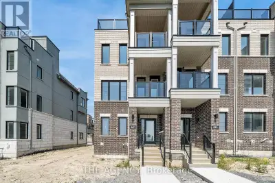 Experience luxury waterfront living at 567 Port Darlington Road, a fully furnished end-unit townhome...