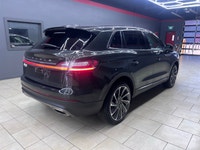 The 2022 Lincoln Nautilus Reserve AWD in a striking green finish combines elegance and performance w... (image 6)
