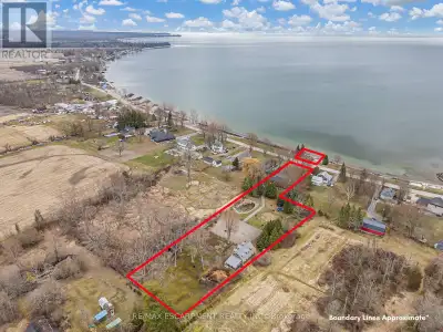 Once in a lifetime opportunity to own a stunning 1.79 acre hobby farm with 102 feet of frontage on L...