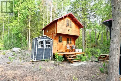 Prime Waterfront Lot with Bunkie, Storage & Landscaping – Sandy Point Area Don't miss this excellent...