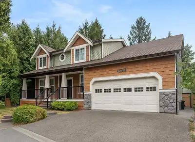 Immaculate 6-Bed, 4-Bath Executive Craftsman Home, centrally located in Langley City. Surrounded by...