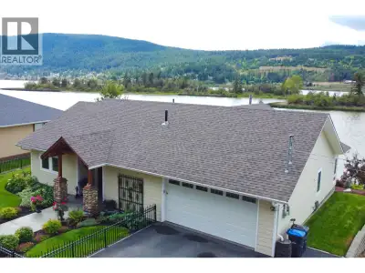 PEACEFUL PERFECTION! Unobstructed lakeshore views, exquisite quality construction, and effortless on...
