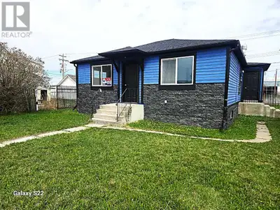 EXTENSIVELY RENOVATED . LOTS of MODERN WHITE Floor to ceiling kitchen cabinets accented with STAINLE...
