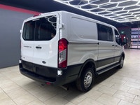 The 2024 Ford Transit Cargo Van T-250 130 Low Rf 9070 GVWR AWD in pristine white is a formidable veh... (image 6)
