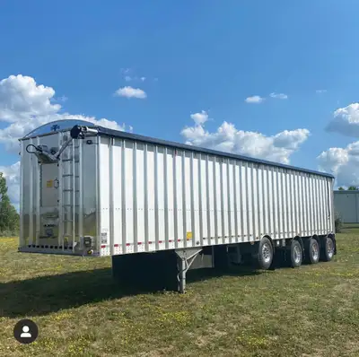 New IMCO 50' quad axle belt-out trailer, 12' walls with 9" raised bows, 105 Cu Yrd capacity, 18,920...