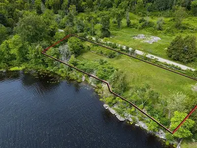 Stunning Waterfront Lot for Sale. Discover this exceptional half-acre property offering panoramic vi...
