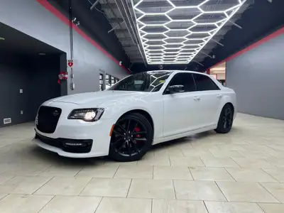 The 2023 Chrysler 300, particularly the 300C RWD in pristine white, is a powerful sedan that truly s...