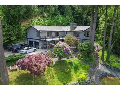 Ultimate privacy on this breathtaking 3 acre executive view property overlooking the Fraser River an...