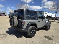This Jeep Wrangler delivers a Gas/Electric V-6 3.6 L/220 engine powering this Automatic transmission... (image 6)