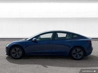 The 2021 Tesla Model 3 offers LED auto-leveling headlights, a panoramic sunroof, and aluminum wheels... (image 1)