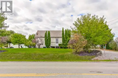 Versatile Country Home on 5 Acres with Commercial Greenhouse. Discover this charming single-family h...