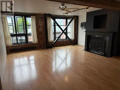 Spacious one of a kind 1,070 sqft. warehouse style loft, exposed bricks, beautiful wood beams, 1 and...