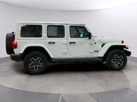 Experience the rugged charm of the new 2026 Jeep Wrangler Sahara 4 Door 4x4 in a striking white fini... (image 5)