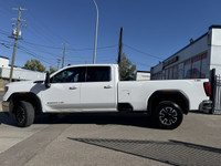 This vehicle is equipped with: 6.6L 8 Cylinder Gas Engine 4Wheel Drive Long Box Heated Steering Whee... (image 1)